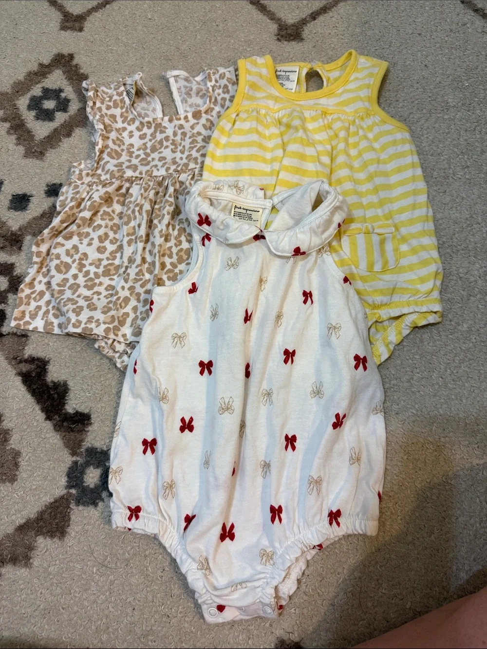 First Impressions White Bodysuit with Red and Tan Bow Accents